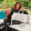 BOLSA DE DEPORTE RIVIERA LE BLANC CON CADENA DORADA Y DETALLE DE TIBURÓN