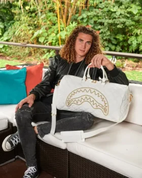 BOLSA DE DEPORTE RIVIERA LE BLANC CON CADENA DORADA Y DETALLE DE TIBURÓN