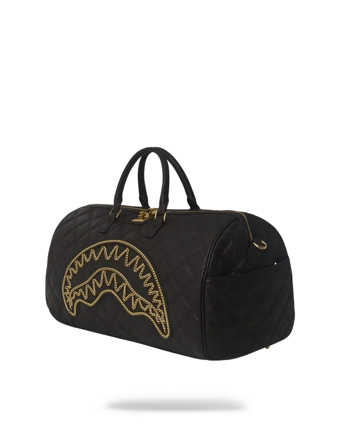 BOLSA DE VIAJE NOIR CON CADENA DORADA Y DETALLE DE TIBURÓN