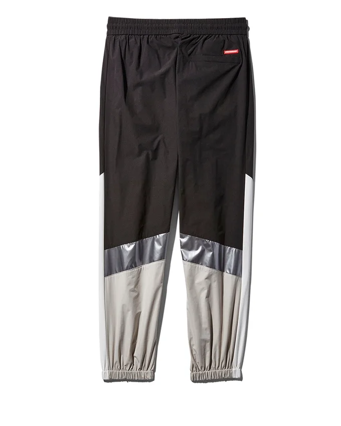 PANTALONES CORTAVIENTO CON BLOQUES DE COLOR
